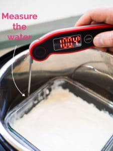 Thermometer measuring the temperature of the water bath