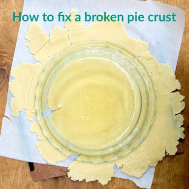 A glass pie dish on top of pie dough
