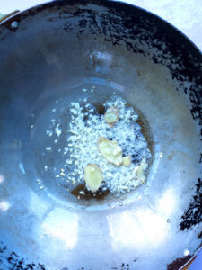 Garlic and ginger in bubbling hot oil