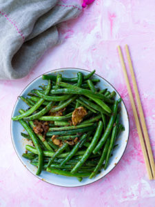 Green Beans with chopsticks and grey napkin