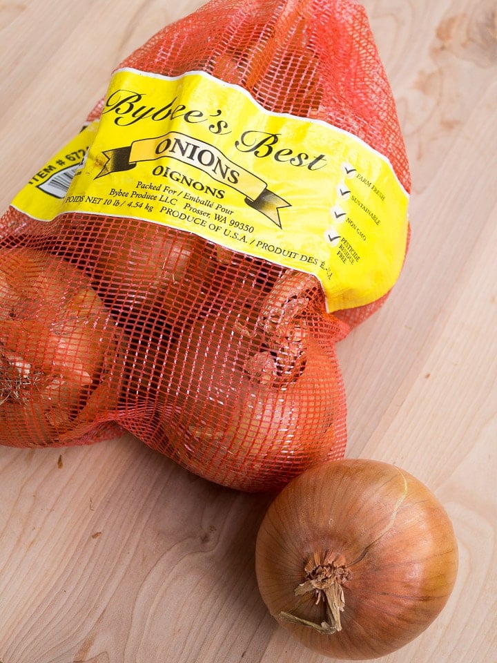 A bag of onions in its original mesh bag