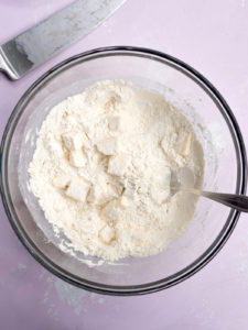 Cubes of butter tossed in wheat flour