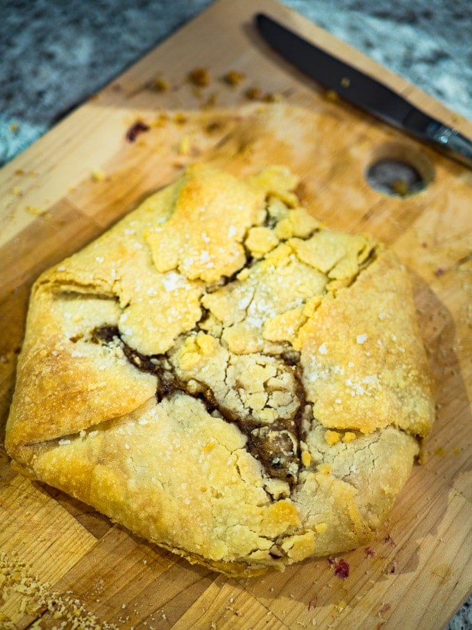 Sweaty Cat Pie without arugula sitting on wooden chopping board