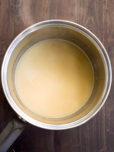 Sauce pan with gravy after the broth was added and stirred