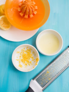 Grated and squeezed lemon zest and juice using grater and juicer