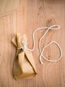 A spice sachet made with a coffee filter with extra long twine
