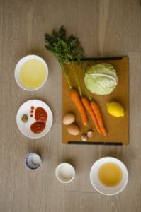 Overhead shot of all ingredients for spicy mayo coleslaw recipe. Recipe from garlicdelight.com.