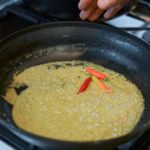 Add the 3 Thai chilis